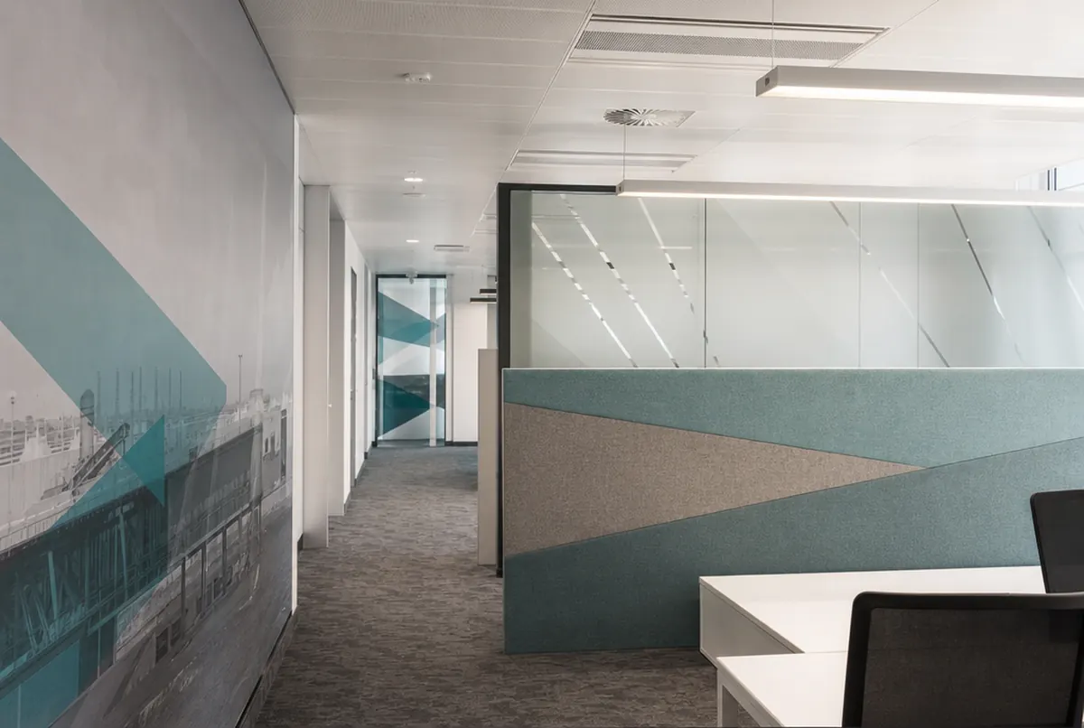 Office fitted out by a renovation company with a wall mural and frosted film