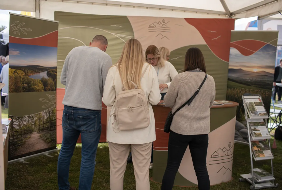 County promotional stand at a fair with a fabric wall and counter