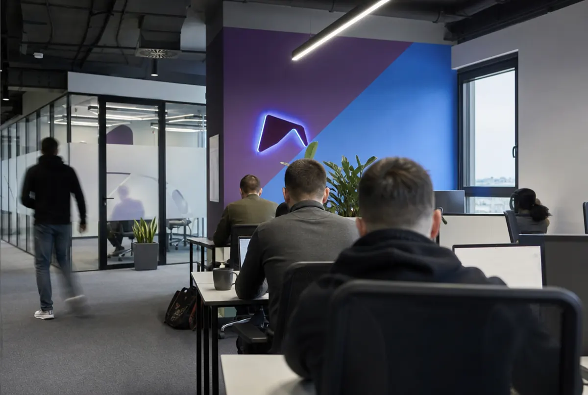 Startup office with wall graphics, an LED neon and frosted film