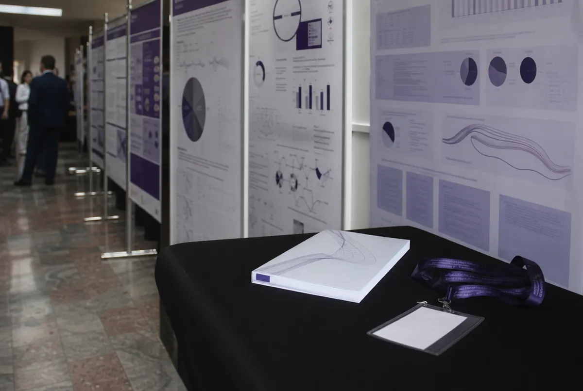 Academic posters at a poster session and delegate badges