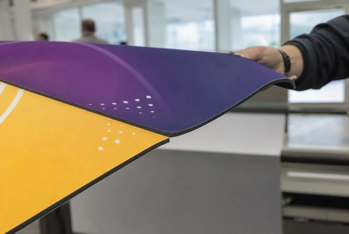Edge of a blockout banner with two different prints and a light-blocking black core