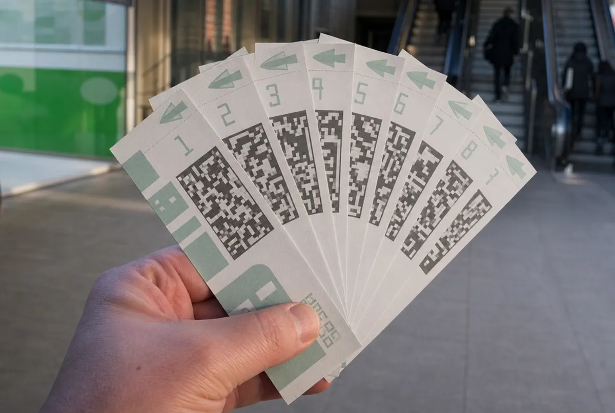 Close-up of a fan of coupons with sequential numbering and different barcodes
