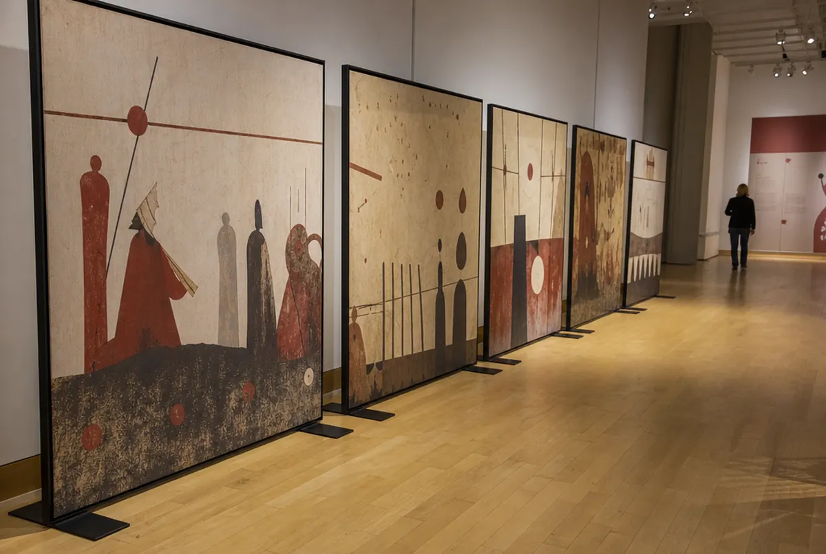 Wall of freestanding SEG modules with sepia graphics at a museum exhibition