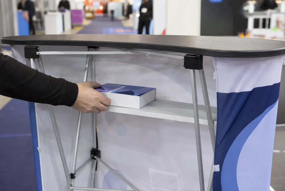 Back of a promotional counter: inner shelf, frame hinges and wrapped front graphic